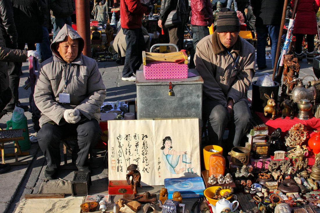 Market vendor and customer negotiating price at a Chinese market stall